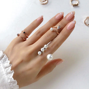 FOUR PEARL OPEN RING